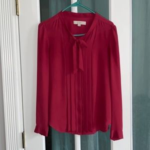 Pink long sleeve work shirt with tie able bow.